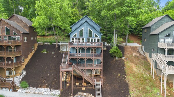 Lakefront home with 3 decks overlooking a cove.  Private 2-story dock w/ slide.