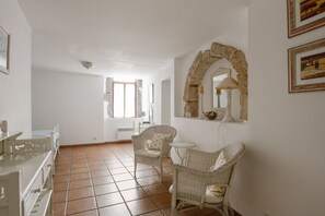 Seating area in the main bedroom which has lots of natural light from the multiple windows