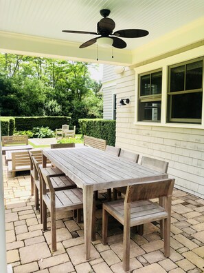 8 seat dining table under ceiling fan. 