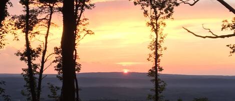 Unbelievable sunsets! Here's your front porch view from at Moonflower Cottage.