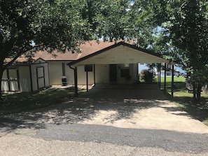 Street side view of house with covered parking