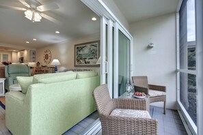 Multiple sliders open up to the enclosed lanai.