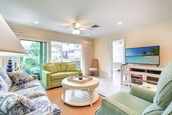 The living room space has a large flat screen TV, Xfinity cable and WiFi