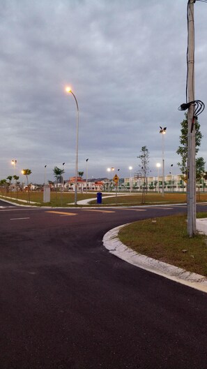 A minute away is a community park with a basketball, football and badminton cour