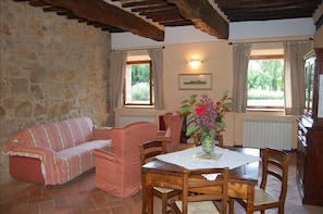 Interior view:floors in old terracotta, beams in wood and antique furniture.