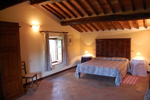 Interior view: one of the bedrooms of the apartment L'Olmo