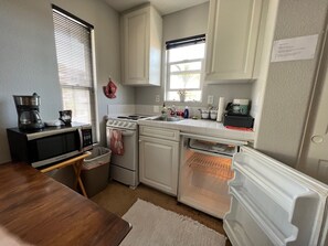 Kitchenette with coffeemaker and microwave