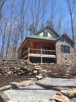 Front of the house near the fire ring