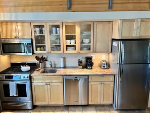 Fully stocked kitchen with full size appliances
