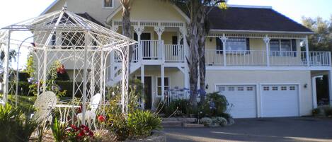 Photo of large tudor style home with granny flat attached.