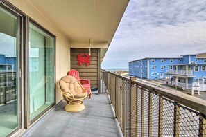 Covered Balcony w/ Seating | Partial Ocean Views