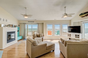 Another view of the family room, vaulted ceilings w/ceiling fans & great windows