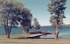 Sheltered harbor for your boat in front of cabin.