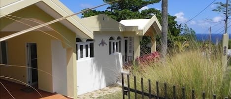 View of the Front of Surf View Villa with the Ocean in the Background