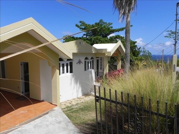 View of the Front of Surf View Villa with the Ocean in the Background