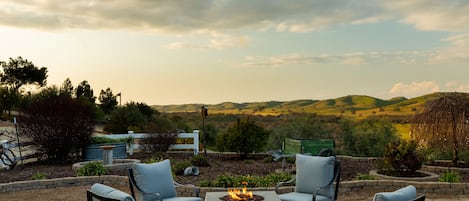 Stay cozy by the firepit with a view.