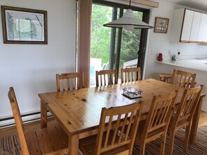 Dining area with access to "breakfast deck" with table, umbrella and grills!