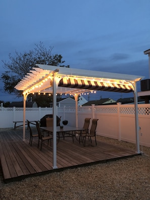 beautiful brand new lighted pergola with sun shade/rain protect.....