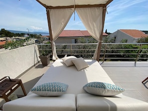 canopy bed on the upper terrace