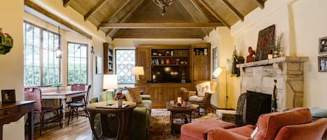 Spacious living room with Carmel stone fireplace.