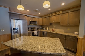 Fully outfitted kitchen has everything you need to dine in.