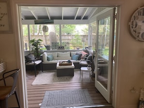 Back porch including couch and dining table fan/light, Bluetooth stereo