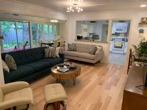 Family Room:  Two sofas, reclining chair, 70" tv