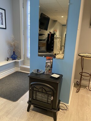 Electric fireplace heater to take the chill off. Air conditioning too.