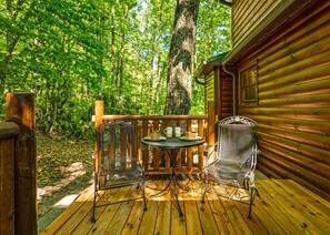 Patio furniture on the back deck to enjoy peace and tranquility in the Smokies.