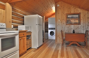 stacking washer/dryer off of kitchen area, dining for 2