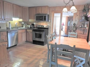 Kitchen, electric stove top, oven, microwave, refrigerator and dishwasher
