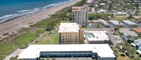 Our beach and building looking south, a  nice beach walk to Cocoa Beach Pier!