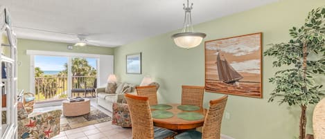 Open living/dining area with sweeping ocean views 