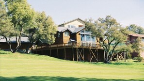 Back view of house which sits on the 4th fairway