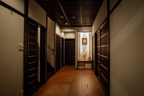 The entrance with the alcove and the Noh mask.