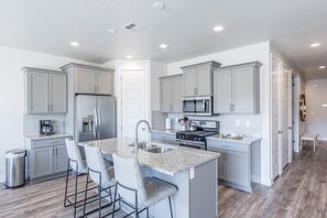 Kitchen Angle View - This sleek, modern kitchen has all the best upgrades to make cooking a breeze!