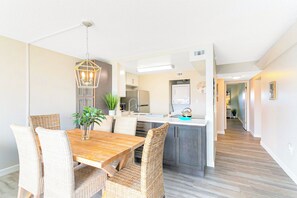 Enjoy an open concept kitchen and dining area with warm coastal touches