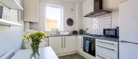 Lovely bright kitchen, with everything you need to prepare a full meal.