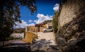 The driveway is steep, you can do a 3 point turn at the top