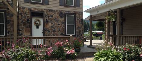  Your apartment is the first floor of the house with the stone front. 