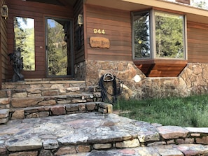 The windows of the entry and kitchen bay reflect this pristine environment.