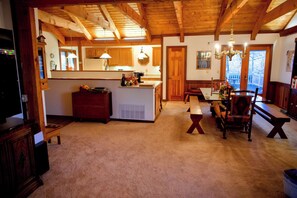 Open concept kitchen adjacent to large dining space and living room.
