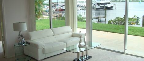 Living Room with New Leather Sofa overlooking the water.