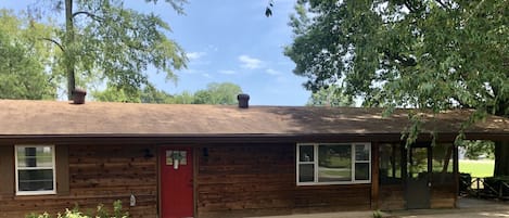 Two bedroom/one bath house, screen porch and carport on a corner lot