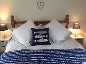 Bedroom with king size bed, White Company quality cotton bedding.