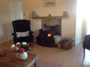 Cosy sitting room with multi fuel stove, air to air heating also.