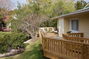 Large deck overlooking a pond with turtles and fish...