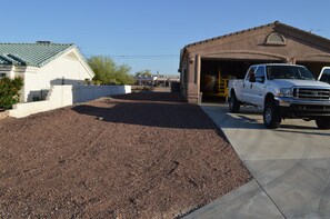 Plenty of RV and boat parking down side of the house