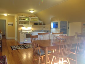 Kitchen with Dishwasher and Granite counters.  Shaker Table and 8 Chairs.
