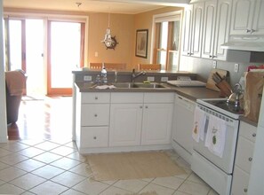 Beautiful and spacious kitchen with view of the beach and water
